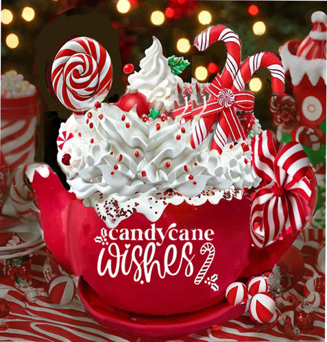 alt= A red mug filled with whipped cream, candy canes, lollipops, and red sprinkles. The mug displays the text 