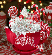 alt= A red mug filled with whipped cream, candy canes, lollipops, and red sprinkles. The mug displays the text 