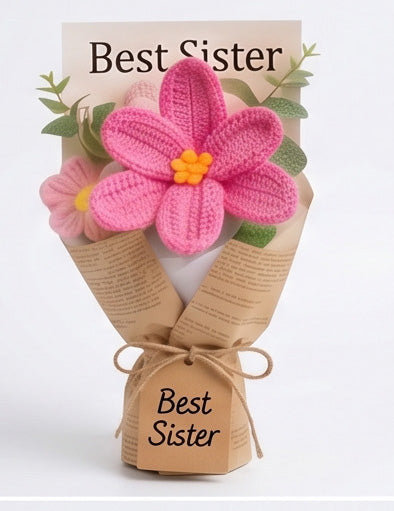 pink crochet flower in newsprint bag